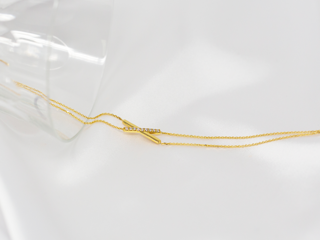 Bracelet "Lien précieux" or et zirconium